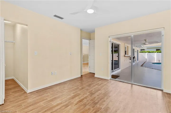 Unfurnished bedroom with a closet and light hardwood / wood-style floors