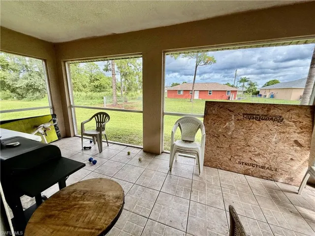 Screened lanai with tiled floors.