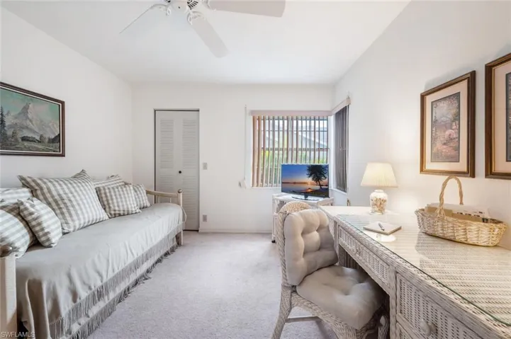 Office area featuring carpet and a ceiling fan