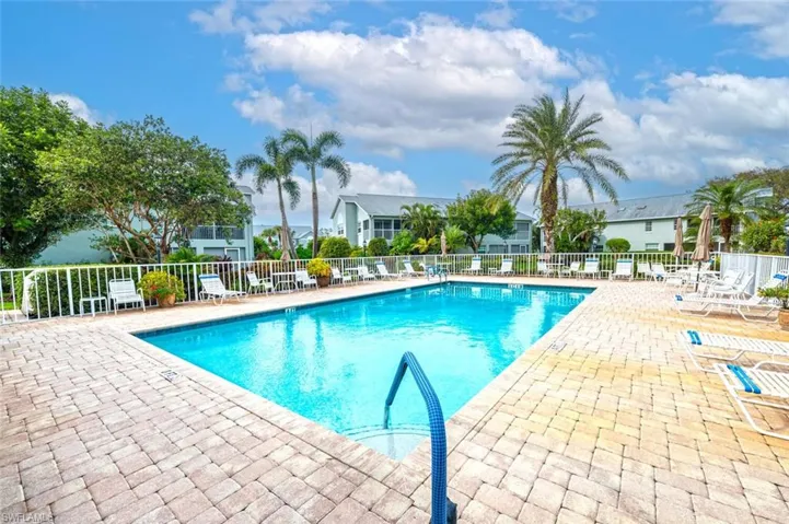Community pool with a patio area