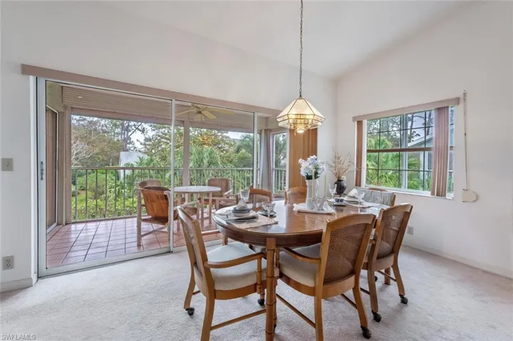 Dining room with carpet and a ceiling fan