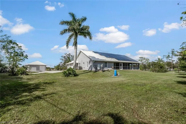 View of yard with a sunroom