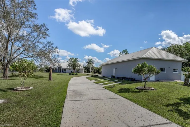 View of property exterior featuring a yard