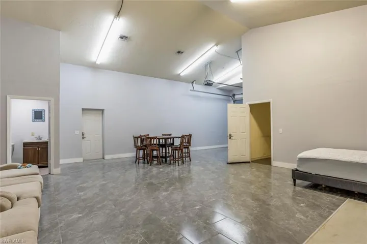 Separate Suite Living room with high vaulted ceiling and sink