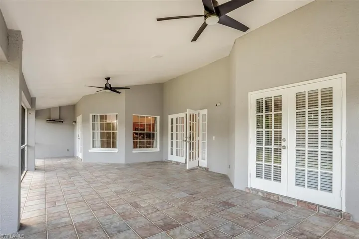 View of patio / terrace featuring ceiling fan and french doors