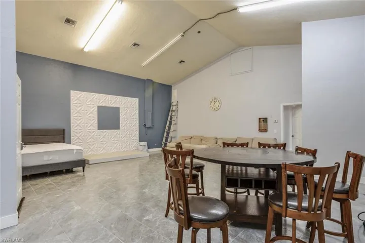 Dining room featuring vaulted ceiling