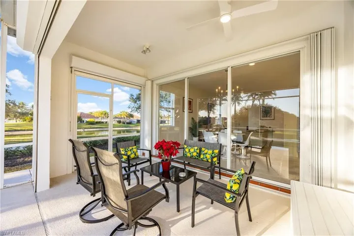 Sunroom / solarium with a water view