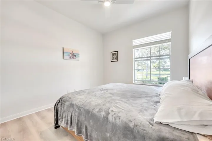Bedroom with wood finished floors and ceiling fan