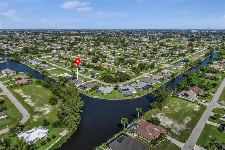 Drone / aerial view featuring a residential view and a water view