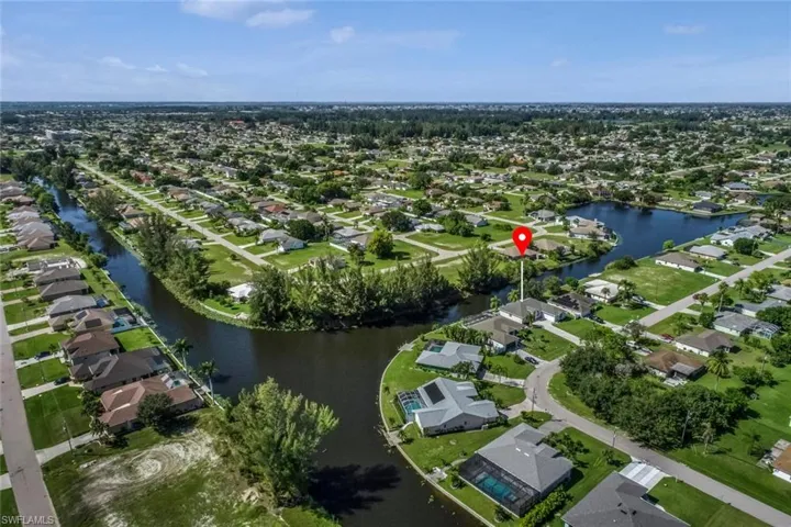 Aerial view featuring a residential view and a water view