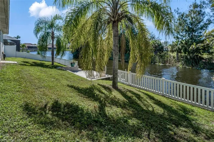 View of yard featuring a water view and a fenced backyard