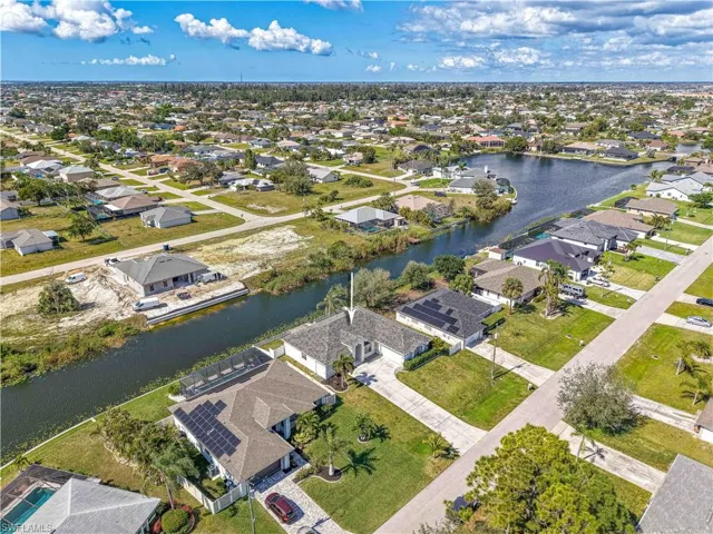 Drone / aerial view featuring a residential view and a water view