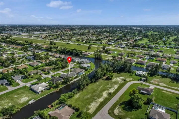 Drone / aerial view with a residential view and a water view