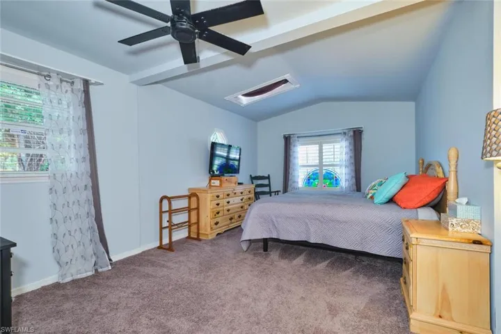 Primary bedroom includes a skylight