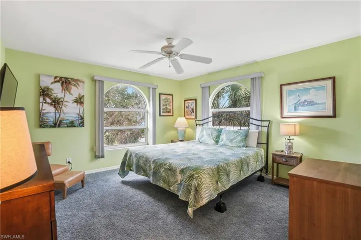 Bedroom featuring carpet and ceiling fan - Virtually Edited Image