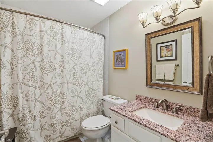 Bathroom featuring vanity and toilet - Virtually Edited Image