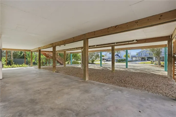 View of patio with stairs and a residential view - Virtually Edited Image