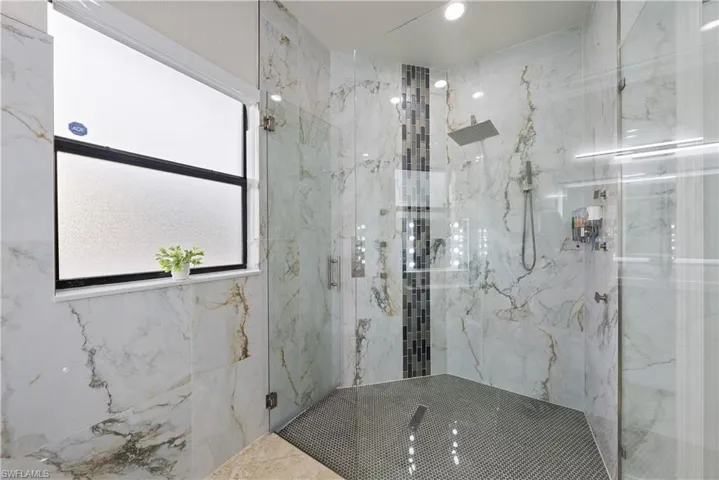 Bathroom featuring walk in shower