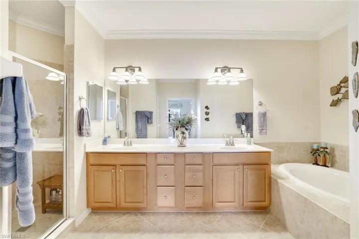 Double Sinks, tub and separate shower in the primary bat
