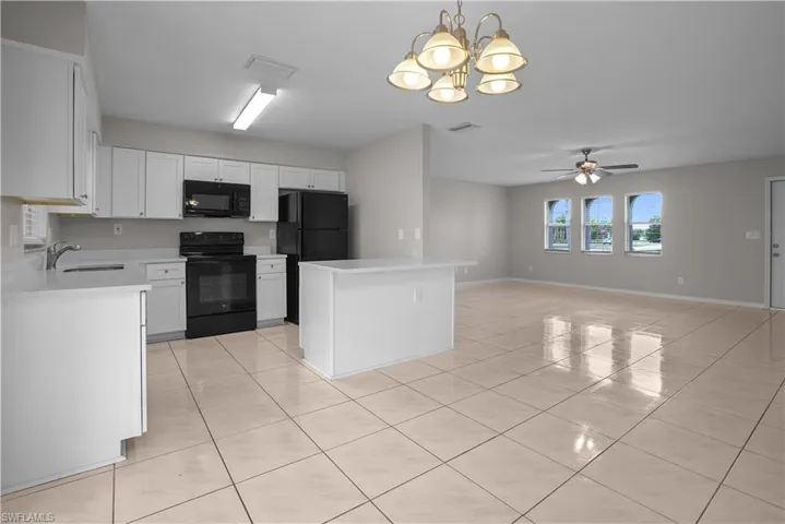 Expansive main living area featuring large format tile flooring throughout