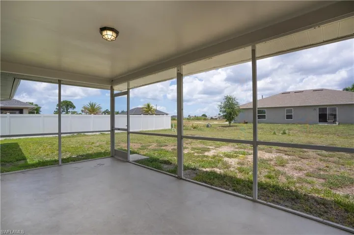 Screened patio with a concrete floor and a contemporary ceiling light fixture