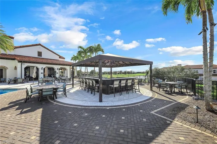View of pool patio outdoor gathering area.