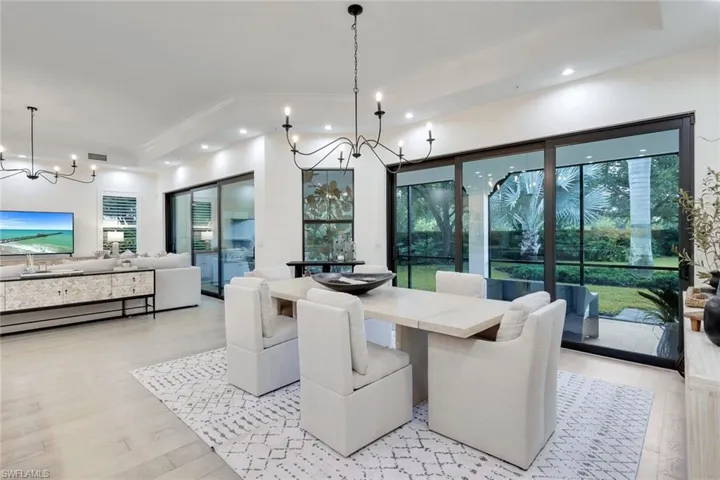 Dining area featuring a notable chandelier and light hardwood / wood-style flooring