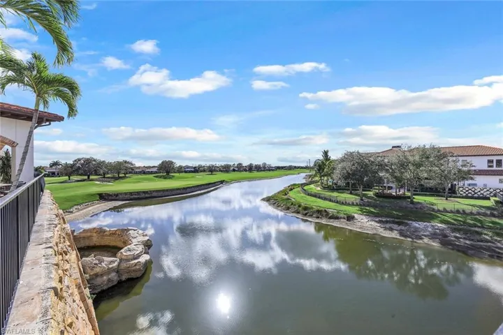 Golf course and View of water feature