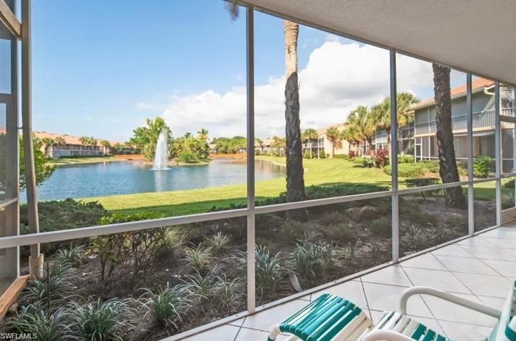 Unfurnished sunroom with a healthy amount of sunlight and a water view
