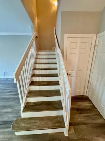 Staircase with wood finished floors