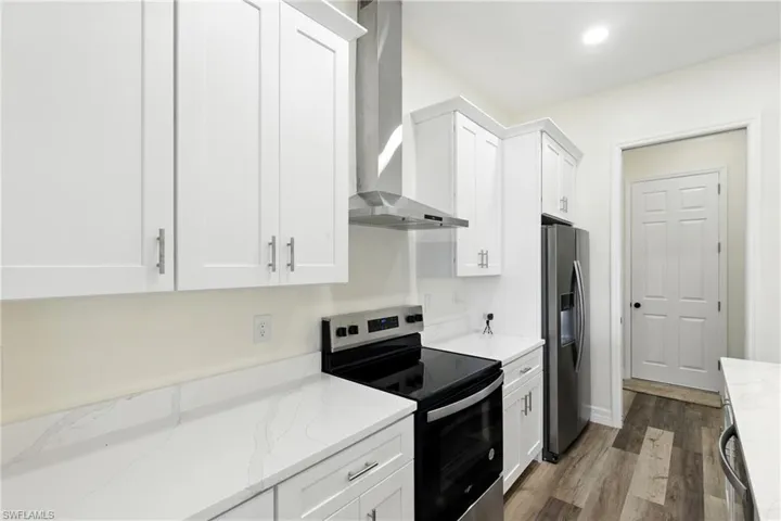 Empty room featuring recessed lighting and light wood-style floors