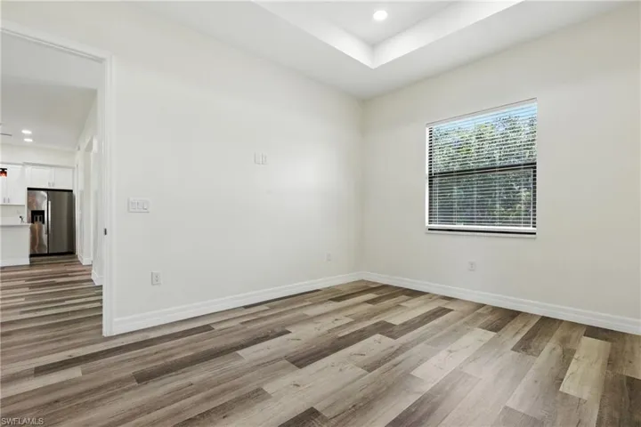 Empty room with wood finished floors and baseboards