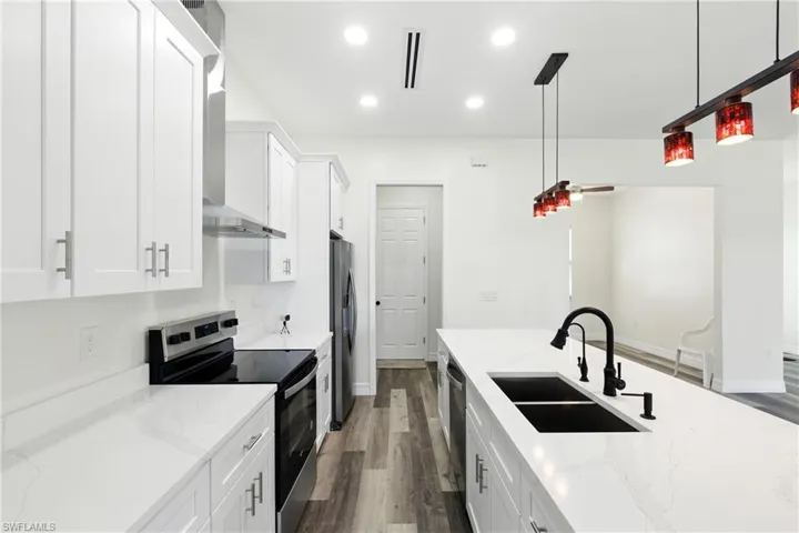 Unfurnished dining area with light wood-style floors and a chandelier