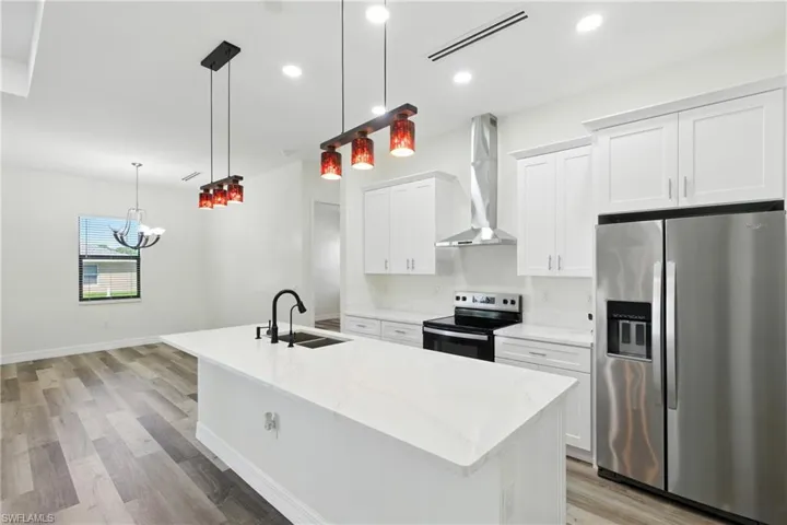 Unfurnished dining area featuring light wood-type flooring and a chandelier