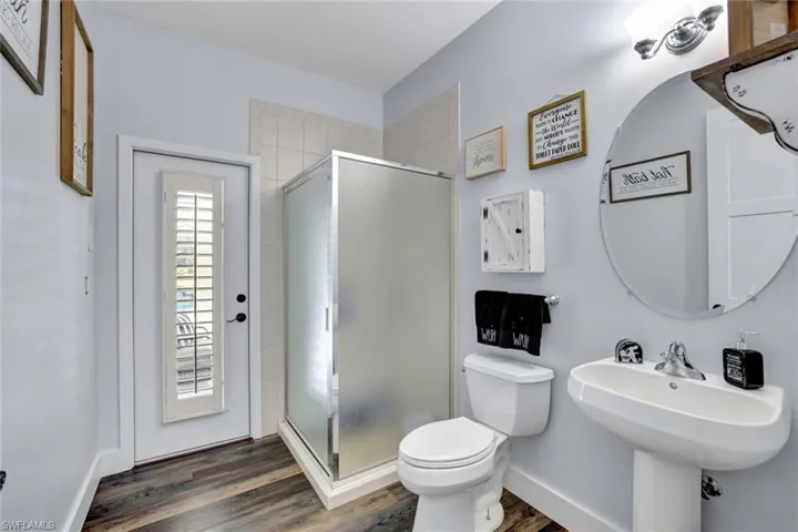 Pool / Guest Bathroom featuring door to lanai