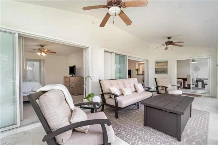 Sunroom / solarium with vaulted ceiling
