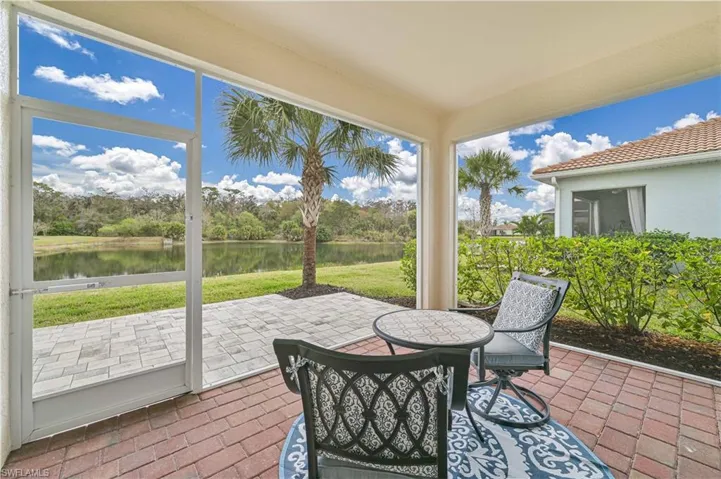 Lanai with a water view and a patio