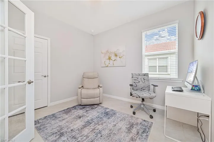 Office with light tile patterned floors