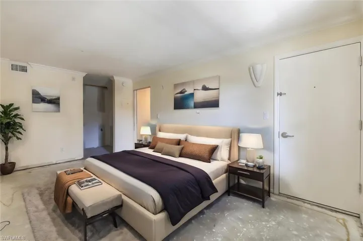 Bedroom featuring ornamental molding and concrete flooring