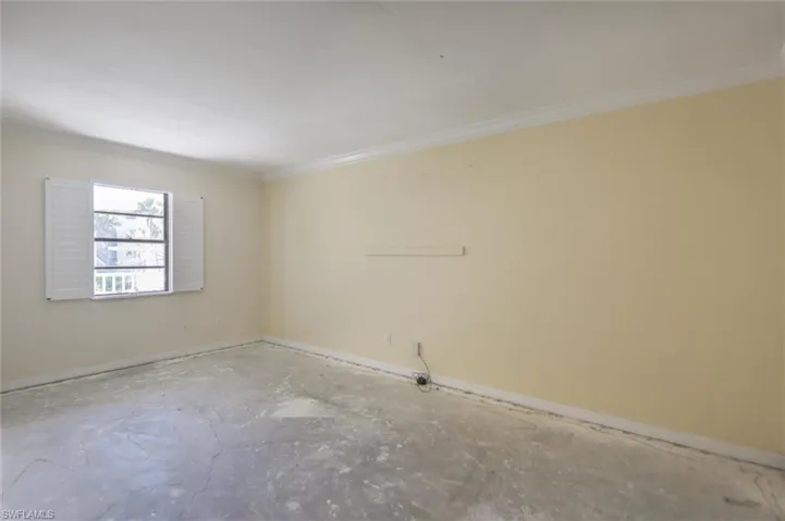 Unfurnished room with crown molding