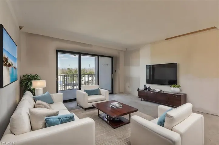 Living room featuring crown molding
