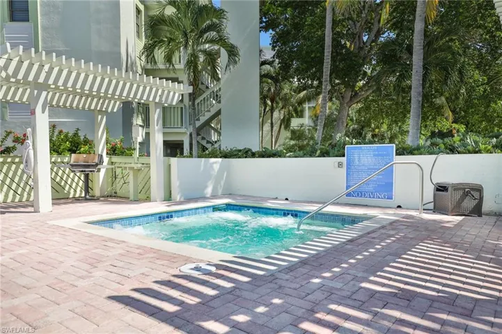 View of pool with a pergola and a patio area