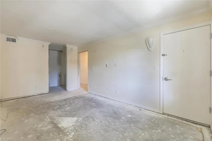 Unfurnished room with ornamental molding