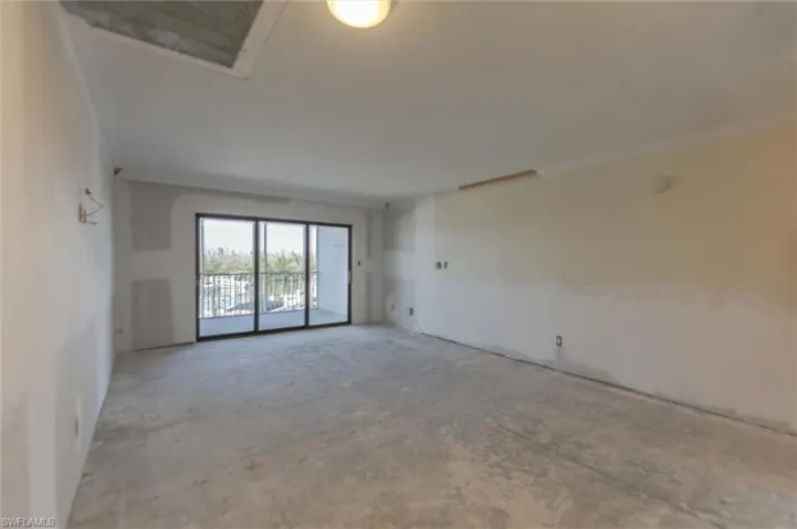 Spare room featuring concrete floors