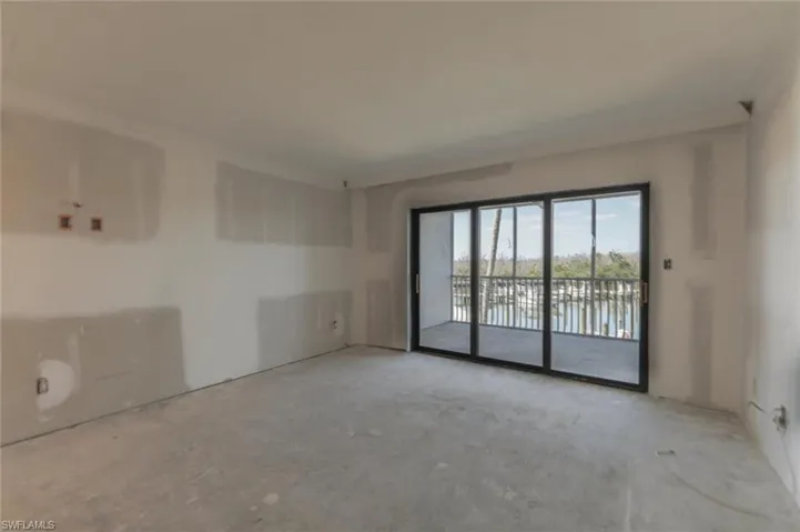 Unfurnished room with concrete flooring