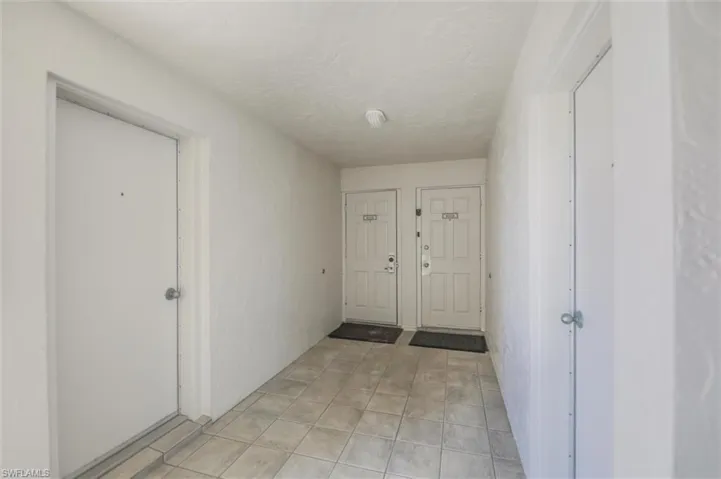 Corridor with light tile floors
