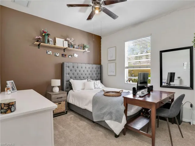 Bedroom with light colored carpet and visible vents