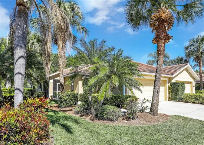 View of front of house featuring a garage, concrete driveway, stucco siding, and a front lawn