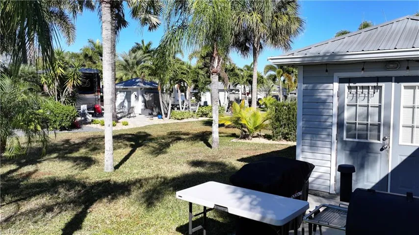 View of grassy yard with a patio