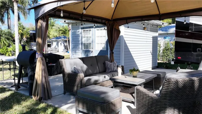 View of patio featuring an outdoor lounge area and a gazebo